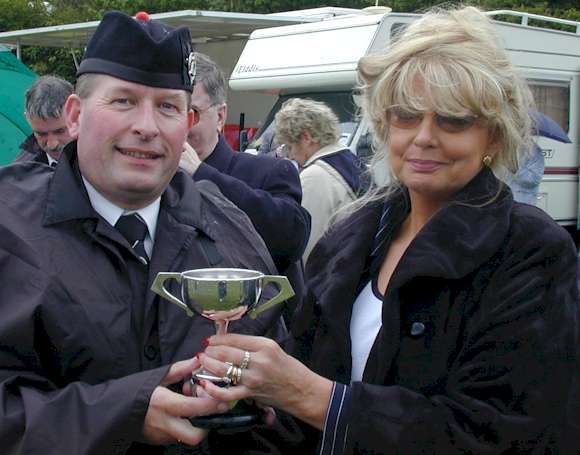 Ronnie collecting the cup for the Best Drum Corps in Enniskillen